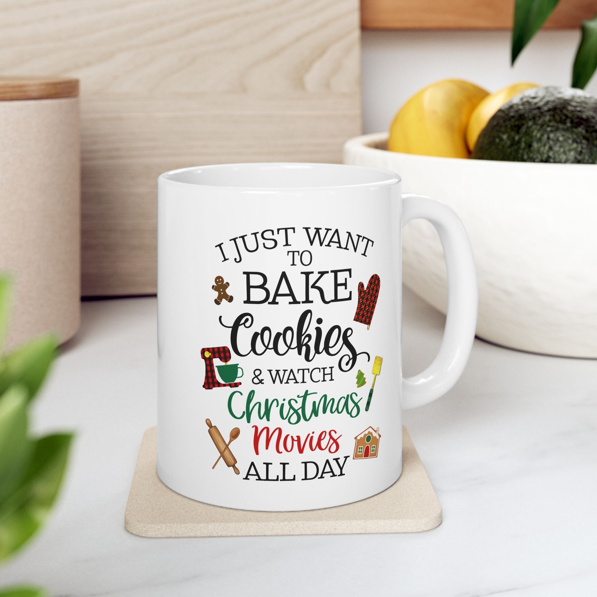 White mug with Christmas-themed text and graphics on a white surface.