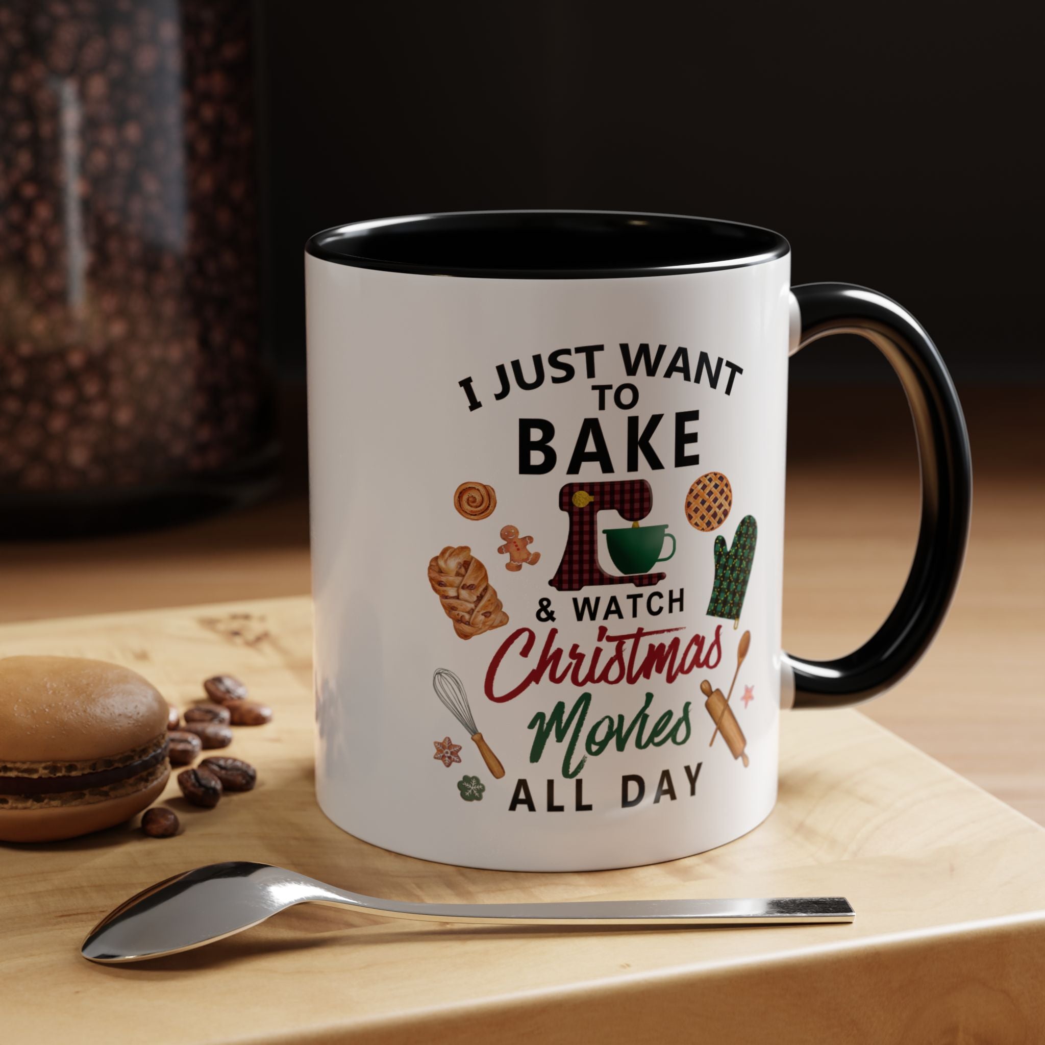 11 oz Mug with black handle with text 'I just want to bake & watch Christmas movies all day' on a wooden surface with coffee beans and a spoon.