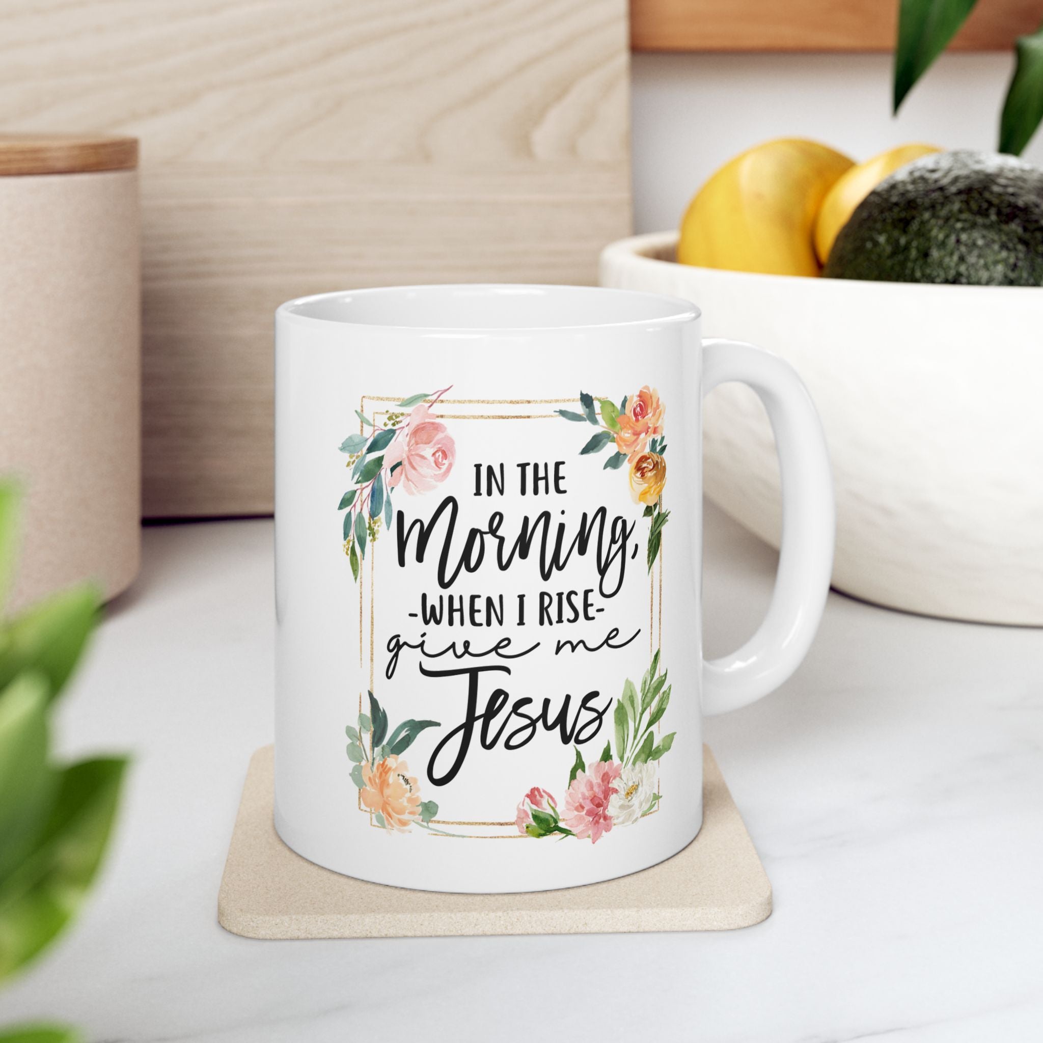 White 11 oz mug with floral design and text on a wooden surface, religious gift for women